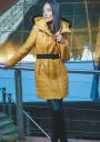 Long women's jacket with a belt in mustard color 22103-301